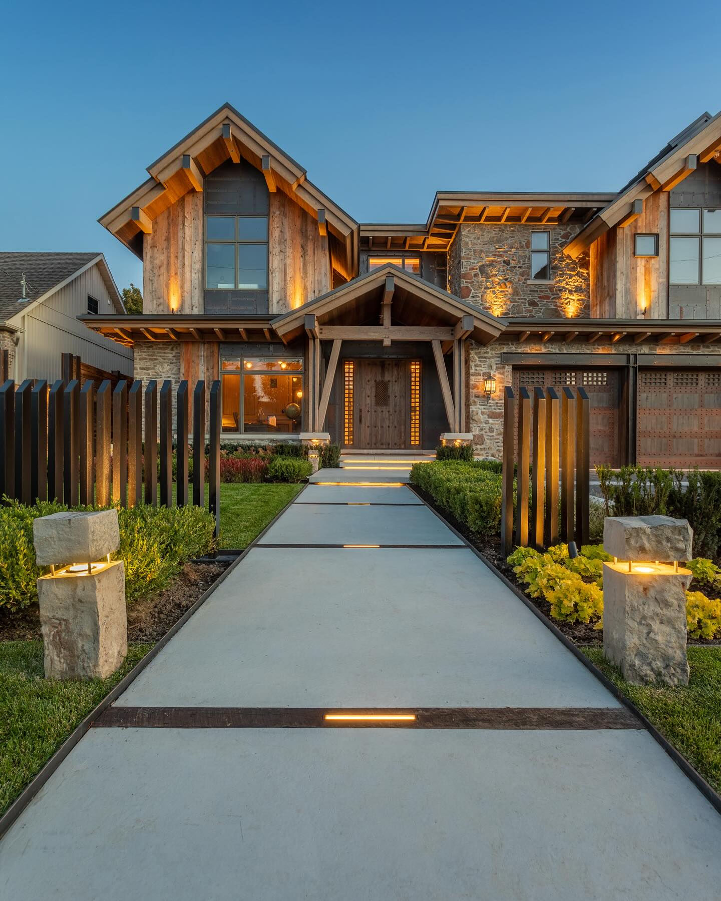 Stone path with integrated lighting and garden bollards