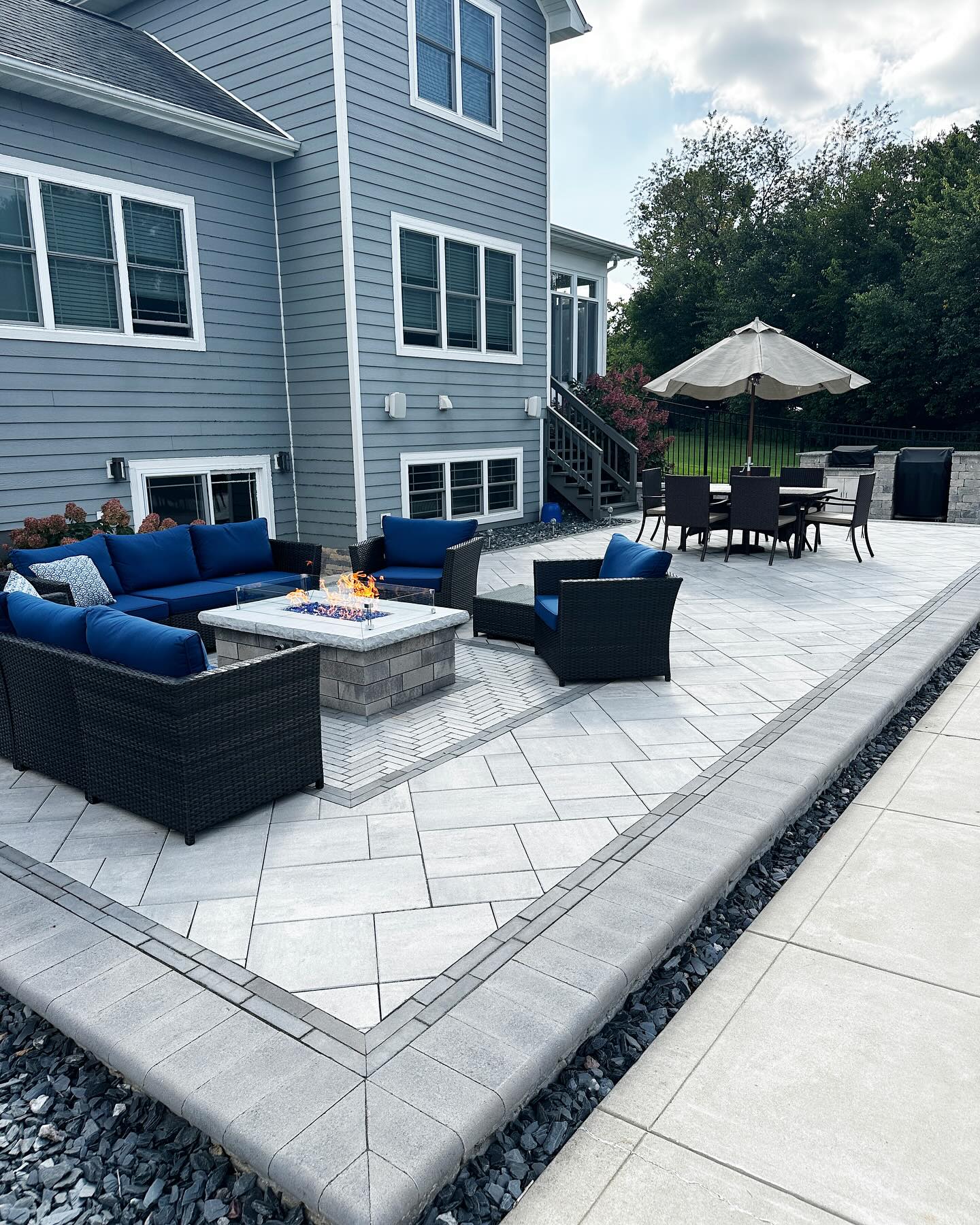 Blue lounge seating and fire table